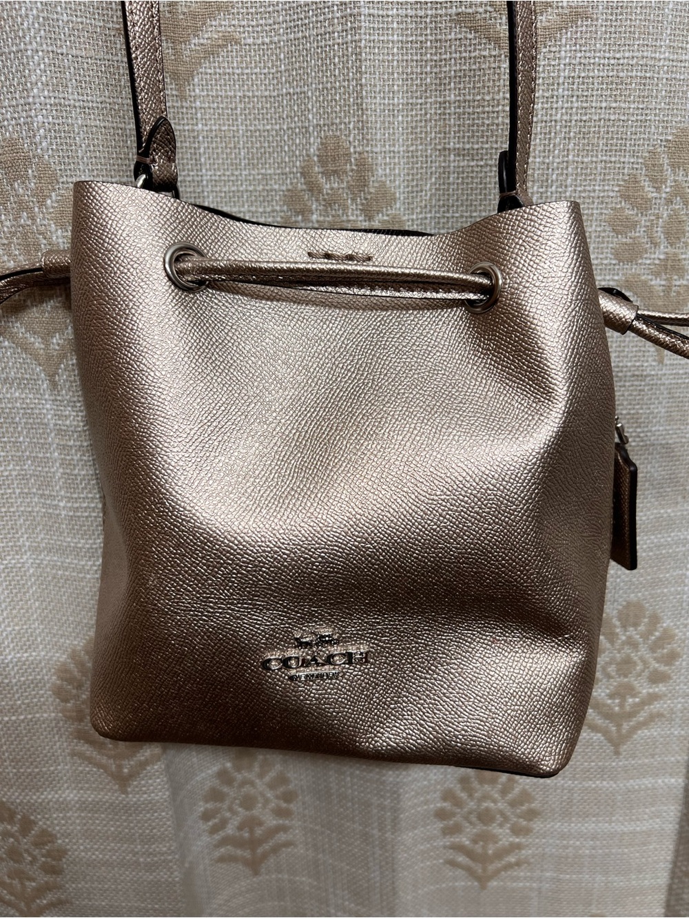 Coach Lena Metallic Rose Gold Drawstring Crossbody Bag